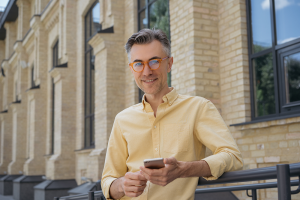 middle-aged-man-using-smartphone-LEVE